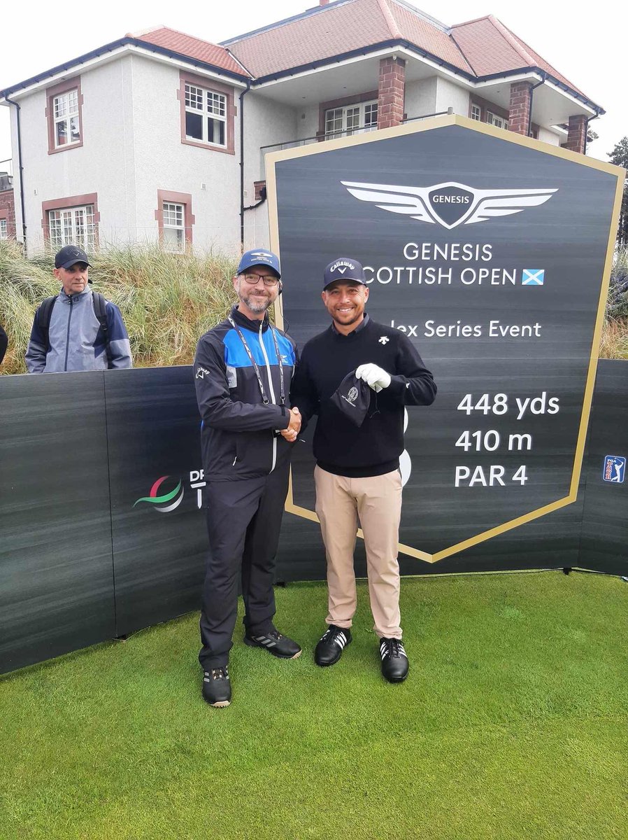 Xander receiving a 250th Anniversary goodie bag from RMGC committee member Stevie Gough.