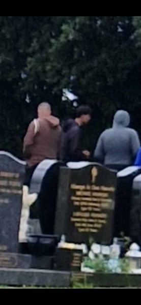 Mick_O_Keeffe's tweet photo. Mother of God! 

'Asylum seekers' in an Irish graveyard disturbing graves and taking coins from a fountain.

🤬 https://t.co/ZhIOyaNVaj