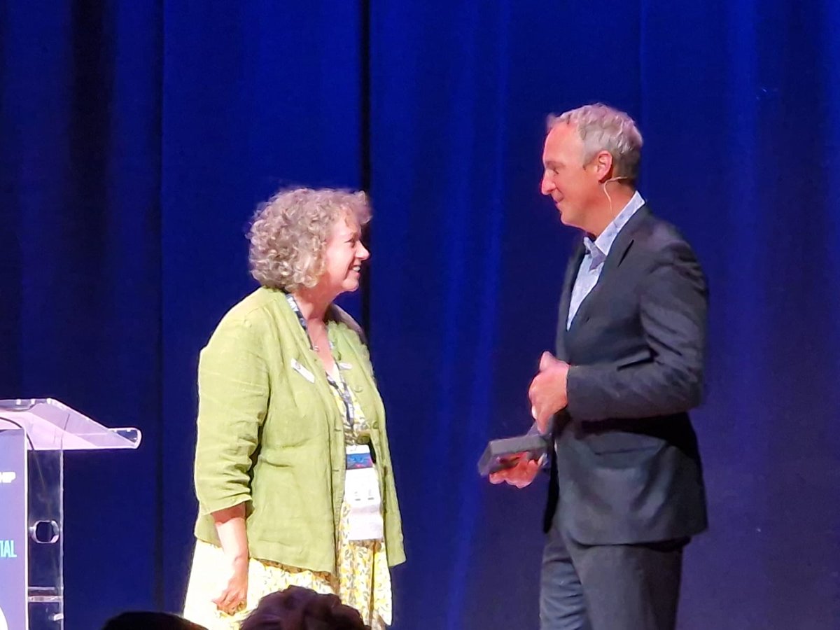 Kevin Eva receiving the gold medal from ASME for outstanding contributions to medical education, sponsored by Inish Education Technology.