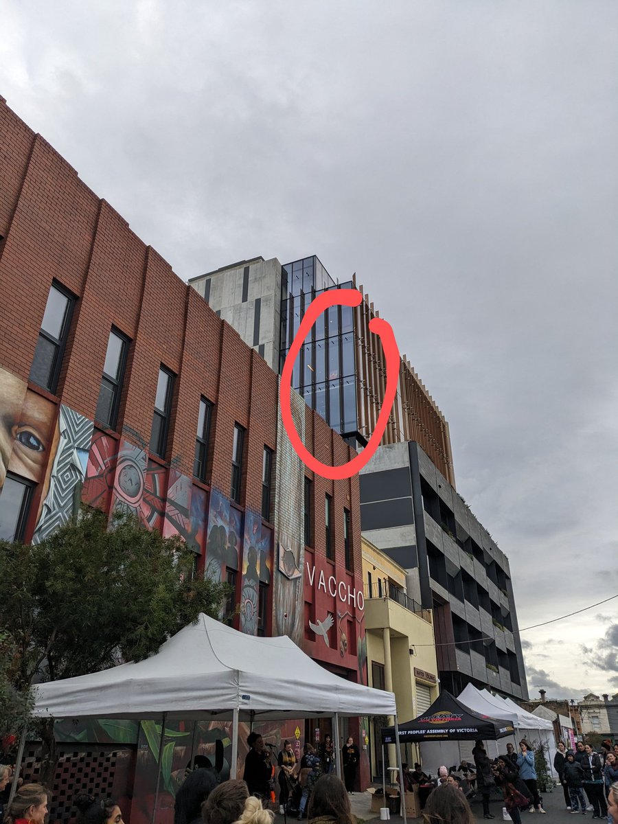 NAIDOC Street Party! <a href="/JillGallagherAO/">Jill Gallagher AO</a> of <a href="/VACCHO_org/">VACCHO</a> thanking neighbours for supporting Aboriginal people and culture, especially through Voice &amp; then I look up to see the circled sign. #keepthefireburning all welcome now for the party - Sackville St, Collingwood. Food &amp;drinks