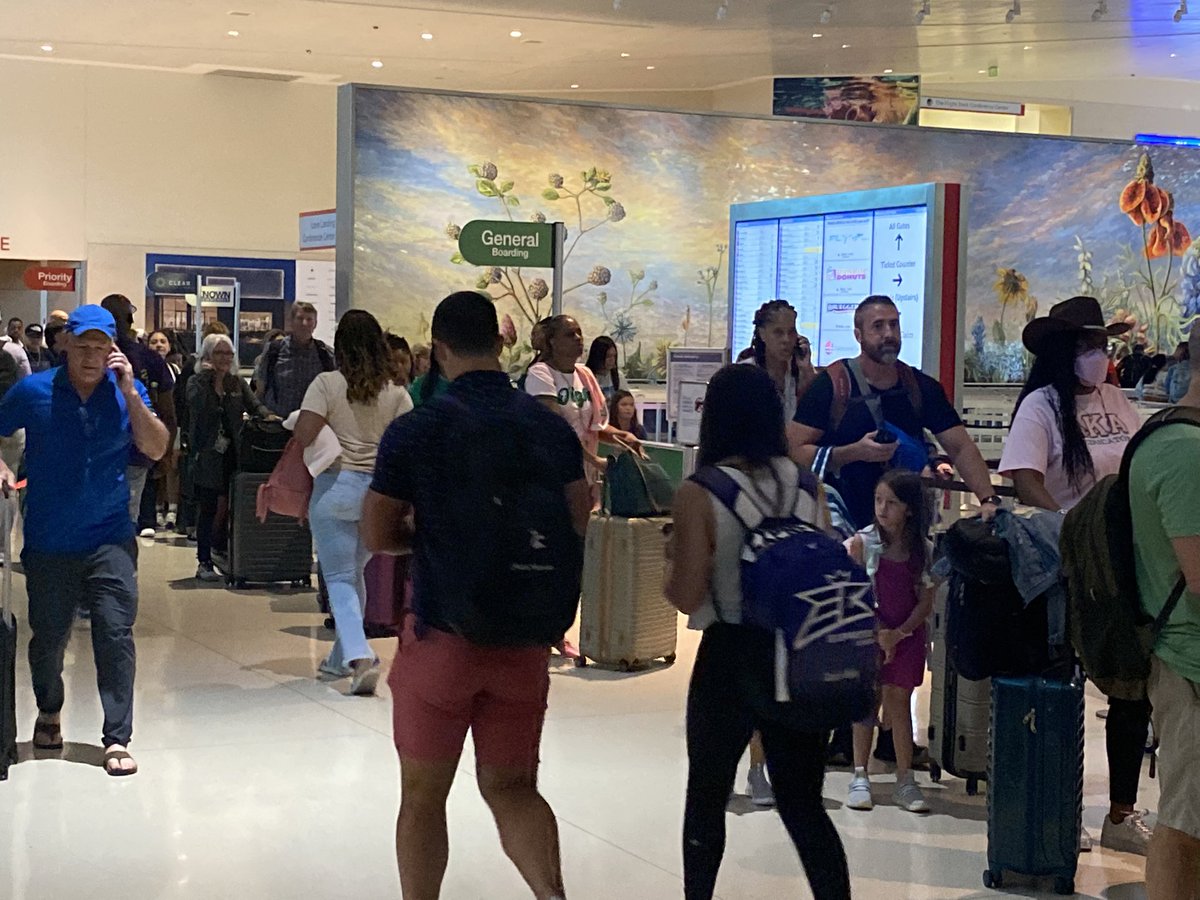 Love Field Airport in Dallas experiencing large lines of travelers. Many passengers upset and not sure if they will make their flight.