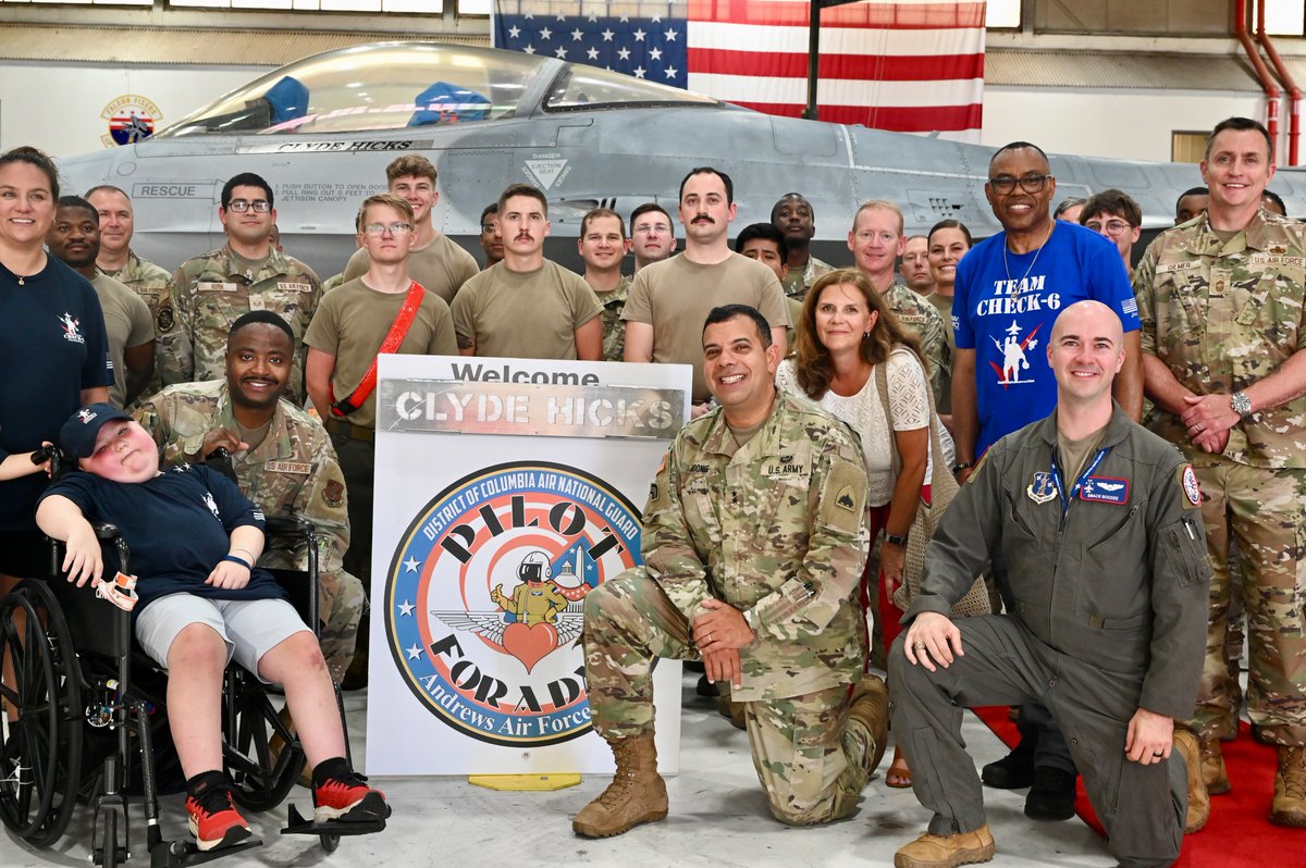 DCGuard1802's tweet photo. Senior leaders welcome 35th Pilot for a Day to @Andrews_JBA!  Eight-year-old Clyde Hicks, the Check-6 Foundation's 35th Pilot for a Day, along with his Wingmen Capt. John Dansby and Christian Okoye, received a tour of aircraft and capabilities at #JBA. https://t.co/ItpRLNU5W1