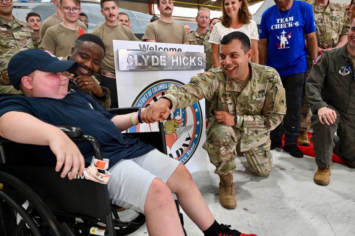 DCGuard1802's tweet photo. Senior leaders welcome 35th Pilot for a Day to @Andrews_JBA!  Eight-year-old Clyde Hicks, the Check-6 Foundation's 35th Pilot for a Day, along with his Wingmen Capt. John Dansby and Christian Okoye, received a tour of aircraft and capabilities at #JBA. https://t.co/ItpRLNU5W1