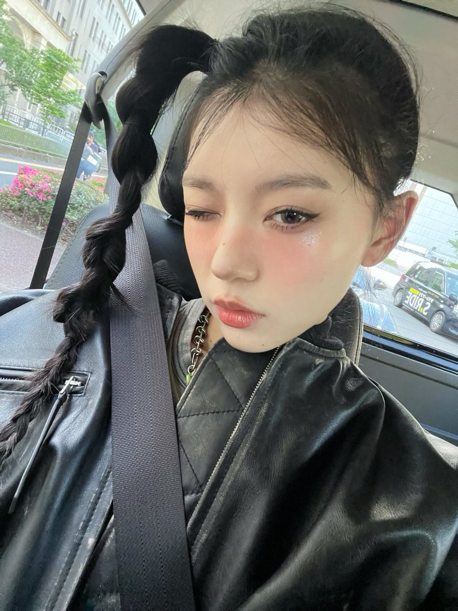 the cool woman tied her hair strangely, while giving you a wink.