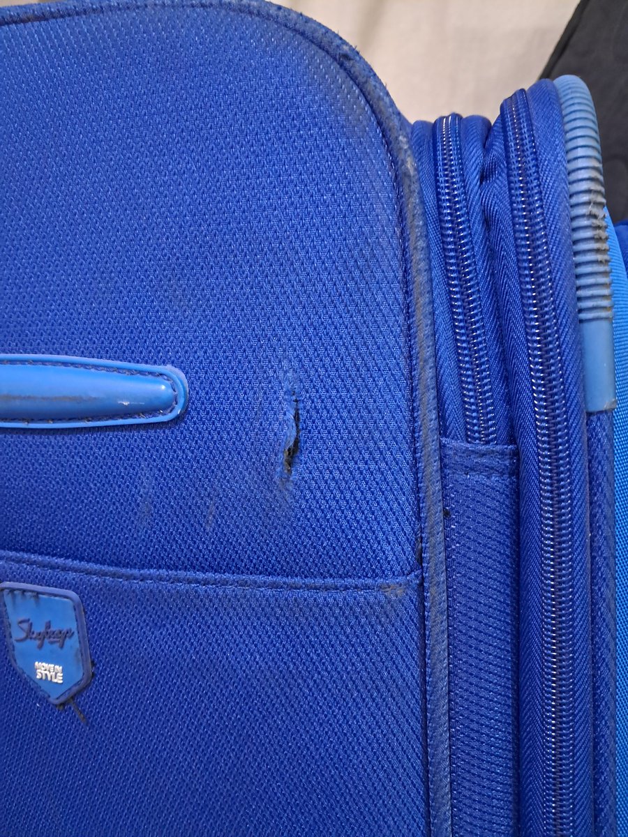 mohitgp's tweet photo. Hey @airindia, For PNR 674FJB NRT-DEL you damaged both my suitcases (one of them was brand new). Something sharp cut all the way through at the same place on both bags. Check the pattern. https://t.co/8GMN8OD0rw
