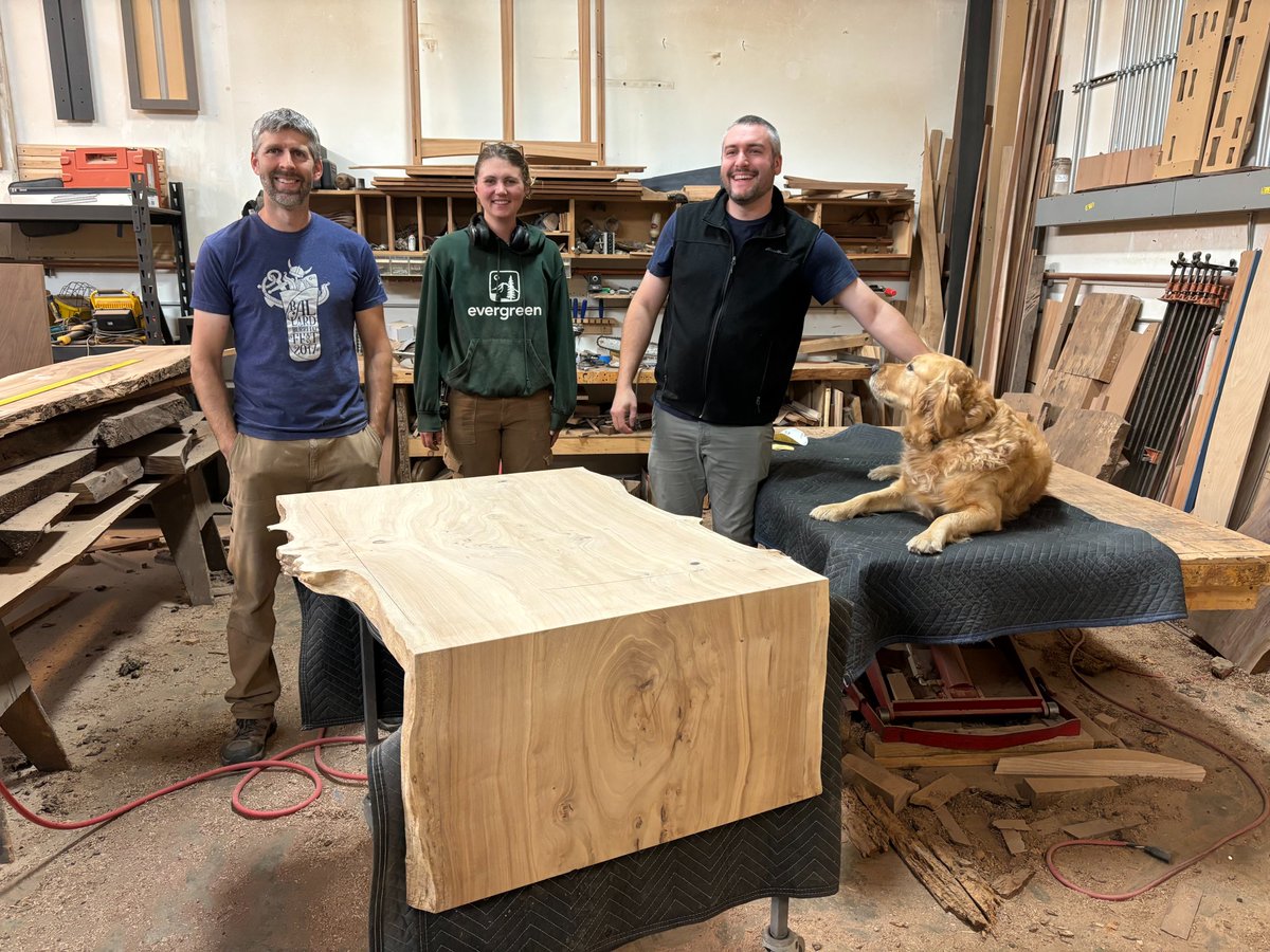 Travis_Gnehm's tweet photo. It brings me joy to work alongside good people at Urban Hardwoods. 

From left to right: Dave (operations manager), Janelle (woodworker), myself, and Goose (Matt's dog) pose for a quick photo after showing a client their custom coffee table in the works. https://t.co/8n38KqkiKr