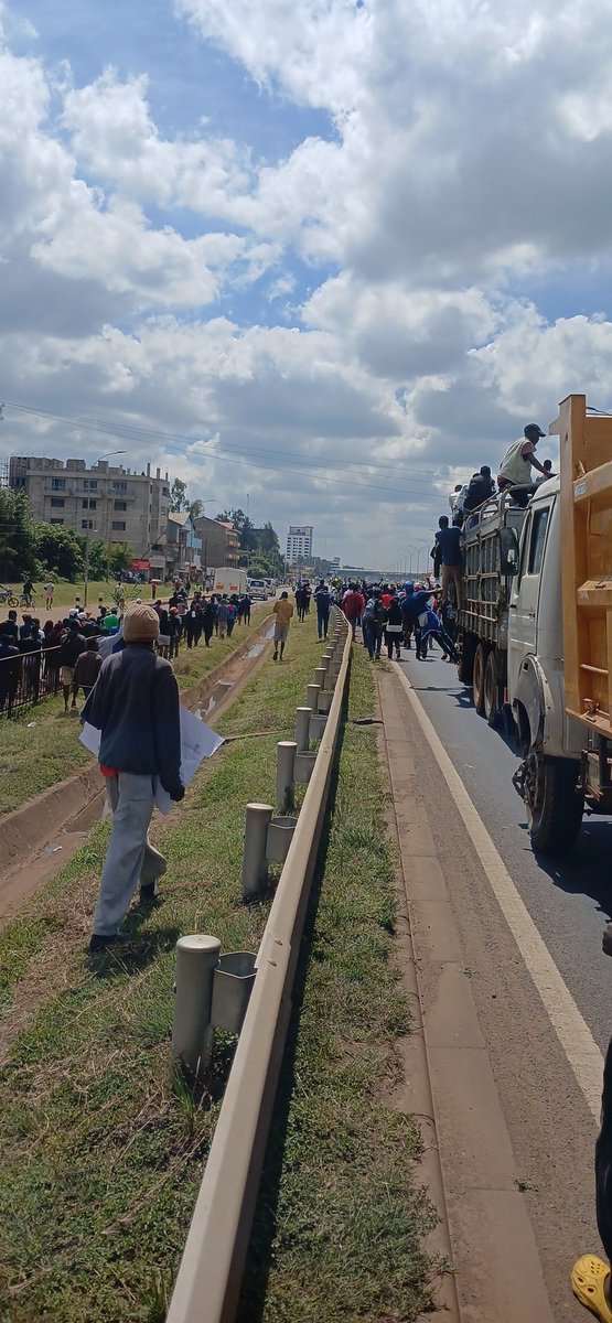 omwambaKE's tweet photo. HAPPENING NOW 
JKUAT Students are currently demonstrating along Thika Road in Juja demanding for Justice for Denzel who's body was found floating in a Swamp!
Thika Road Currently closed at Juja! https://t.co/ZFt4Ul4aBv