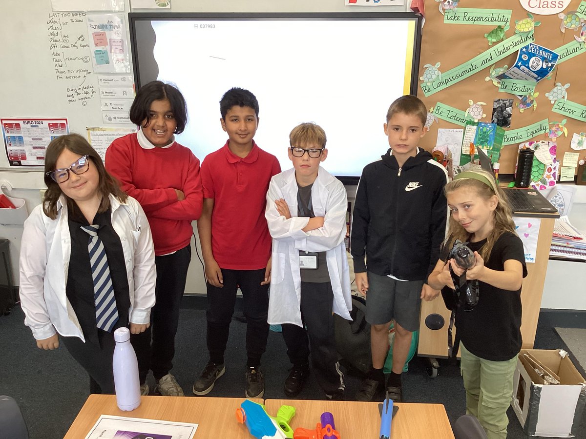 BMJClassof25's tweet photo. Today is COSMIC DAY in Year 5! We are having a 'reading cinema' to hear the final few chapters of the novel, a Cosmic pub quiz and we have come dressed-up as characters from the novel! Can you spot Florida, Liam and Dr Drax? @frankcottrell_b #readingforpleasure #bmj https://t.co/ylpWZ03En0