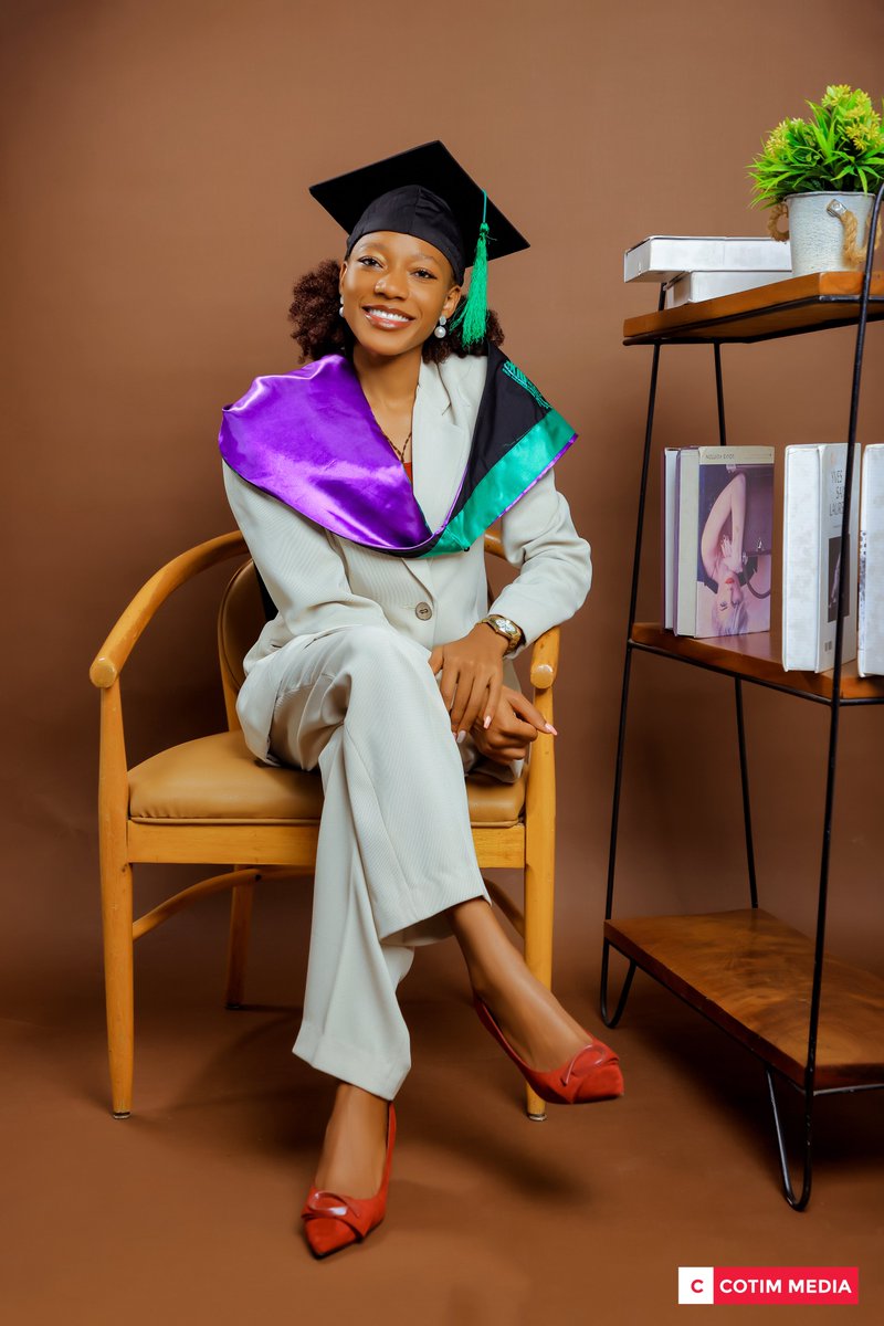 Congratulations. Cathy Celebrating her Academic Achievement in our Studios at UK Mall Kansanga