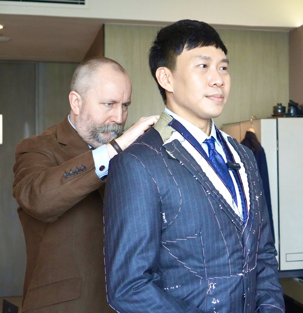 RobBaileyTailor's tweet photo. It takes a lot of concentration and experience to create a perfect finished bespoke garment.  Here our good friend Mr Martin Phu was receiving a first fitting in Bangkok in May. Later this month we return to give him his finished fitting 👌 https://t.co/pWblAWZN1d