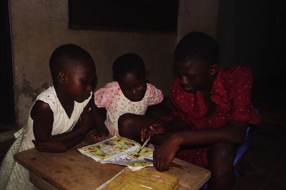cocoa360_'s tweet photo. Watching Adriana Quaisie teaching her sisters- Ruth and Angelina Quaisie, basic two students at the TBGS on how to read and helping them with their homework is truly inspiring! Seeing the love and patience she pours into every lesson reminds us how powerful  family bonds are. https://t.co/pjUaoTx7co