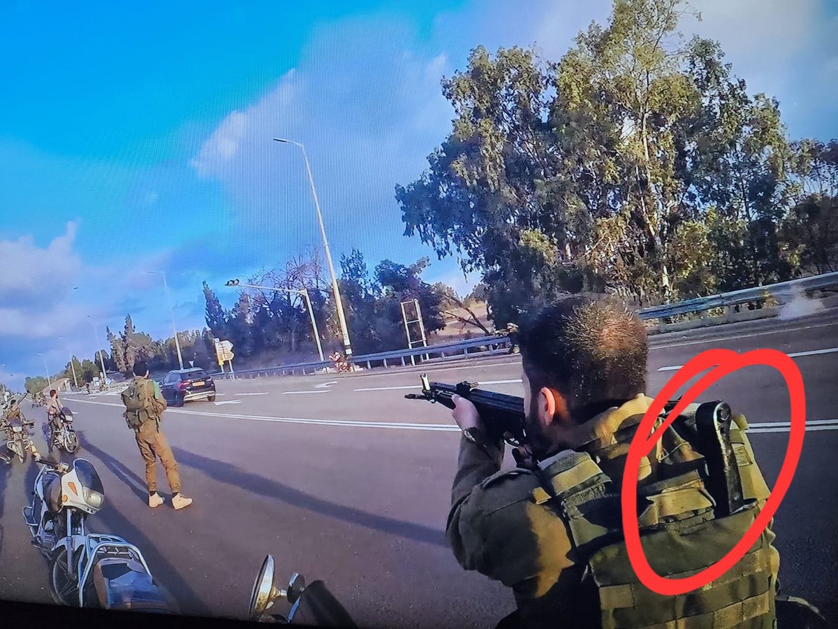 YosephHaddad's tweet photo. Notice this photo from October 7th. A Hamas terrorist in his vest has a machete, also donning a stolen IDF uniform. The genocidal terrorists didn't just come to murder Israelis - they also came to abuse the bodies, cut off heads, and amputate organs.  
Hundreds of Israelis’ bodies from that day prove they succeeded in doing so. The whole world needs to know these horrors!!!
