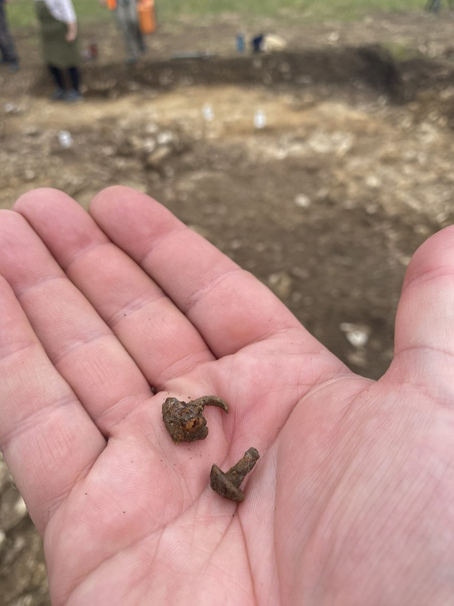 richardhosgood's tweet photo. Into the circular Roman house now and finding hobnails, pots (squashed!) and animal bone. A Roman spoon outside too. Not much time left to resolve the form and function but hopes are high. The hearth tomorrow…. #Archaeology #Wellbeing #veterans @CotswoldArch @thetimeteam https://t.co/BBpFxLqOcL