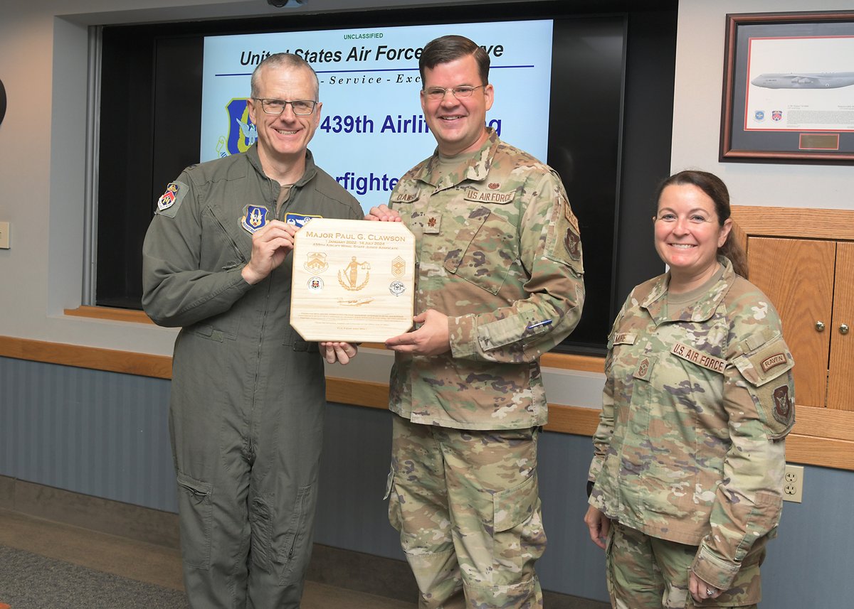 Farewell Major Clawson!
On July 11 Col. G.  Buchanan, 439th Airlift Wing commander, presented Major Paul G. Clawson a token of appreciation for his three years of service as Westover’s Staff Judge Advocate.   Thank you, Maj Clawson, and we wish you success in the Lone Star State!