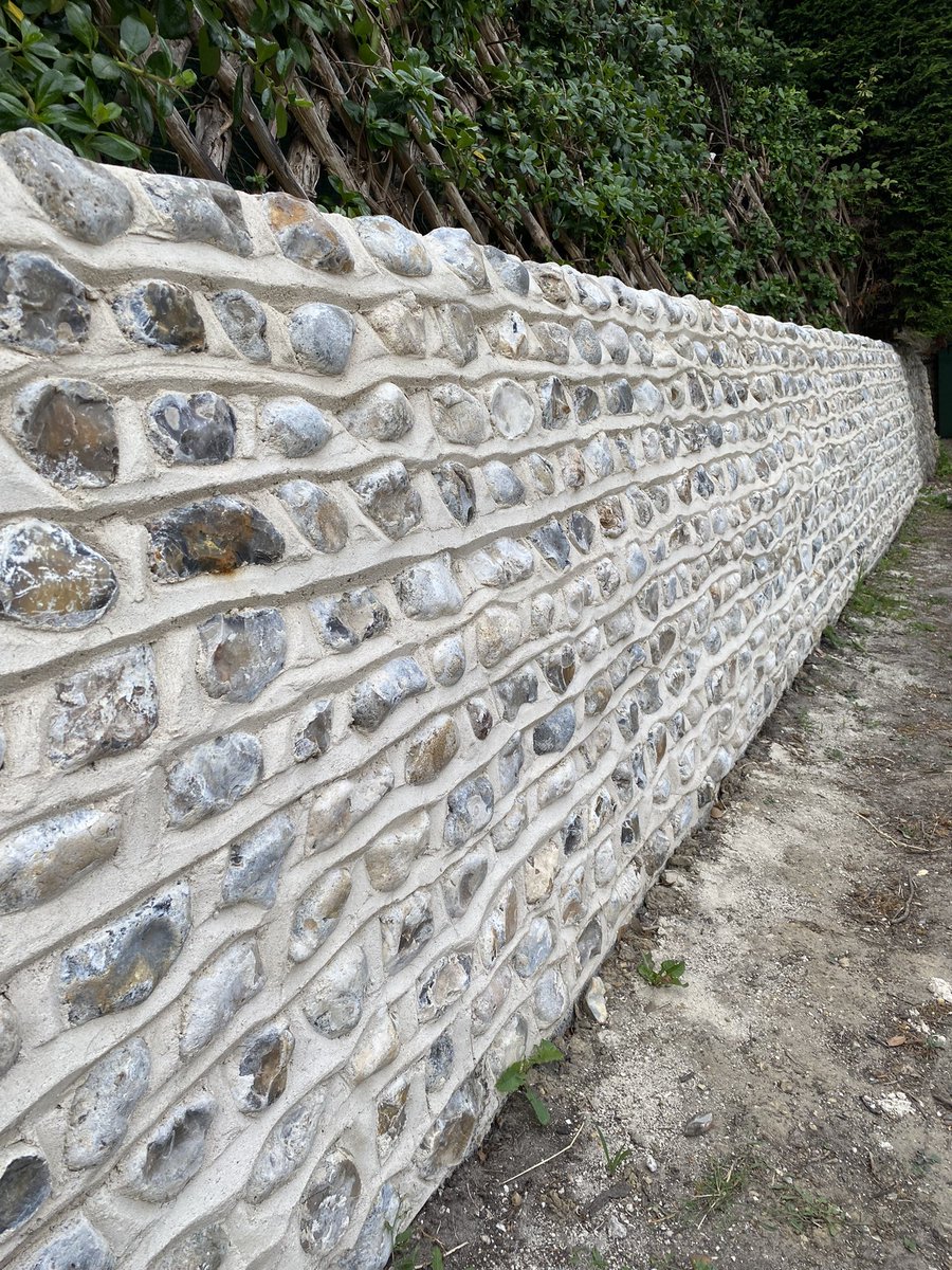 edgebrickwork's tweet photo. Flint wall rebuild taking down the existing wall cleaning up &amp; reusing the original flint. Using restoration sand &amp; NHL 3.5 Lime to match the original mix. #westwittering #flintwork https://t.co/qFh24wUpCE