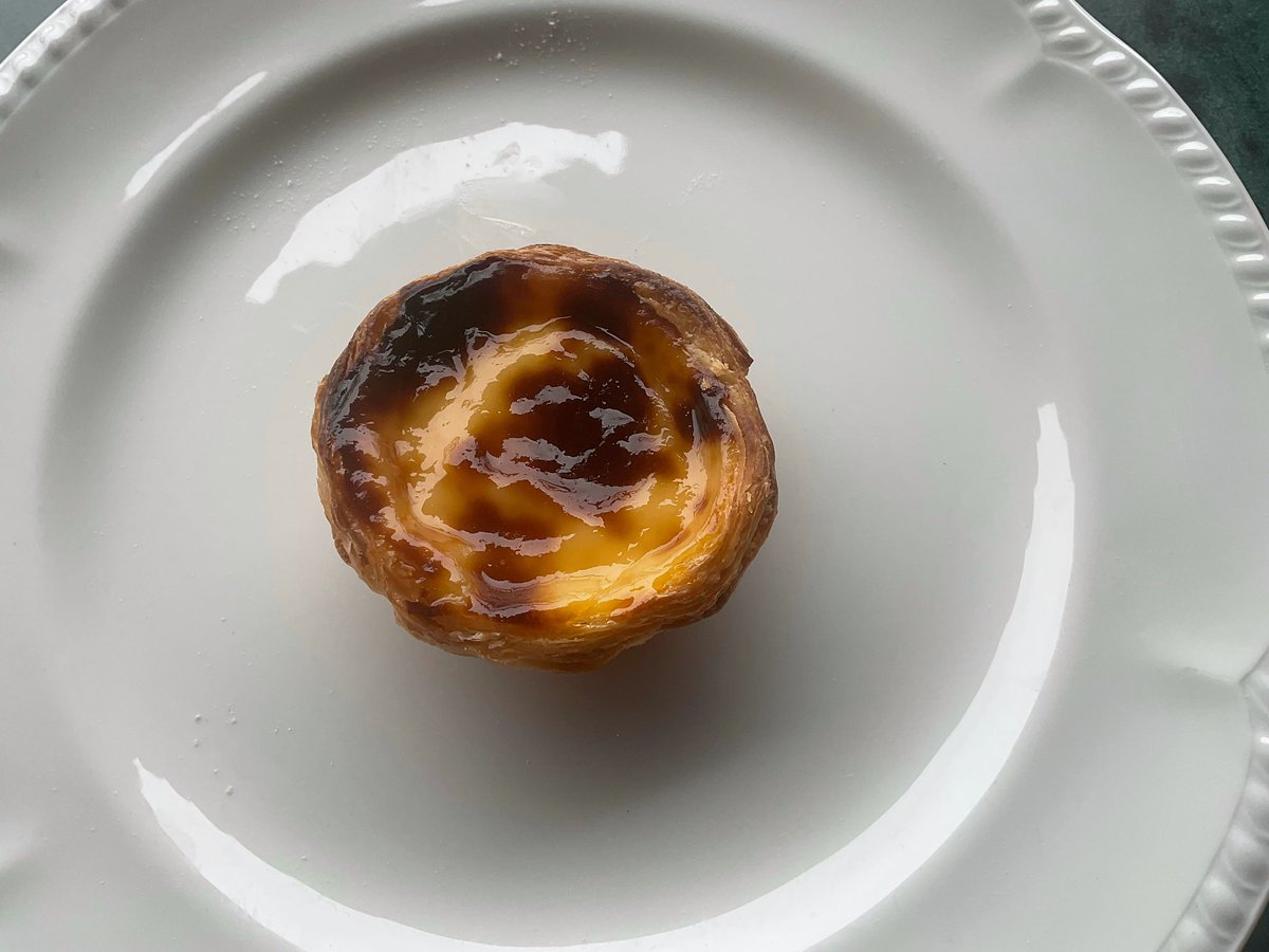SDRobertson54's tweet photo. Is there anything better than the feeling of biting into a fresh pastel de nata (Portuguese Tart). This one from a local bakery in Funchal was absolutely delicious; crunchy, sweet and still warm. #pasteldenata #lovemadeira #foodtodiefor https://t.co/1hkuTPc5UN