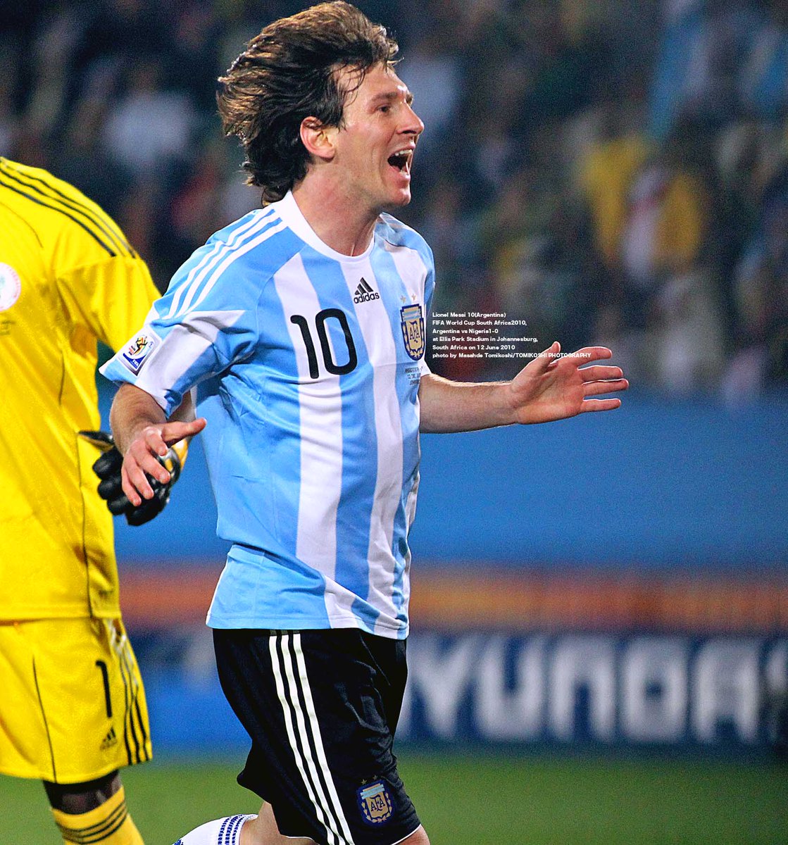 Argentina's Lionel Messi enters the pitch with a child escort during the  2010 FIFA World Cup group B match between Argentina and Nigeria at Ellis  Park stadium in Johannesburg, South Africa 12, image size:1119x1200
