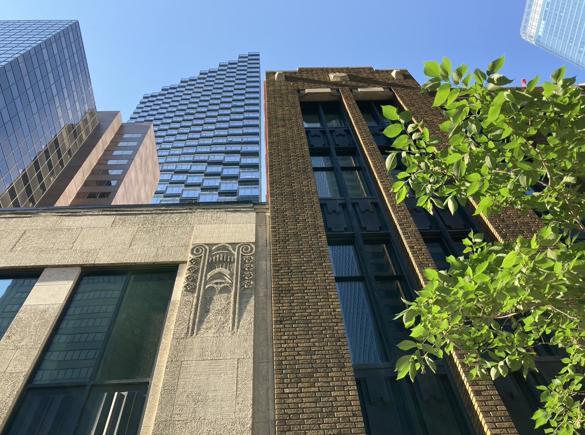 Look up.
Look way up. 
In front, an #ArtDeco detail on the 1939 Utilities Building, with a smidge of the 1929 AGT Telephone Building on the right.
Behind it, Hanover Place (1980) flanked by Telus Sky (2019).
Right corner- photobomb by Brookfield Place (2017]. #YYC