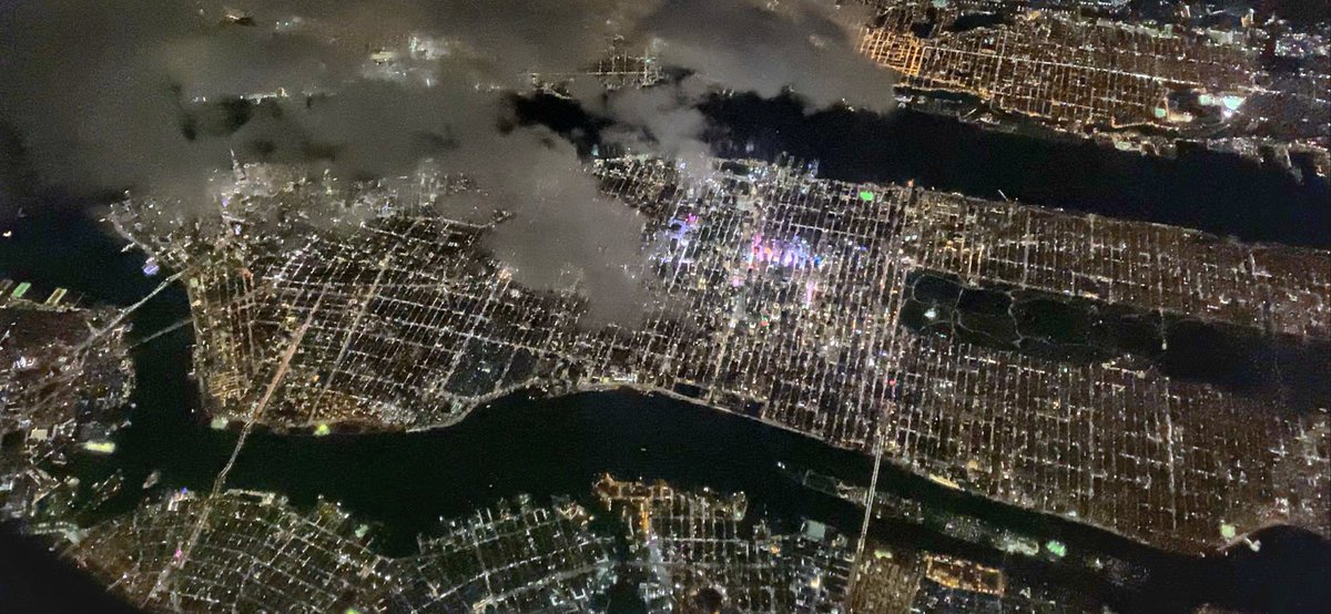 EHolvig's tweet photo. @thepointsguy Our AA pilot maneuvered over a break in the clouds and gave a nice wing tilt for this spectacular view of Manhattan from far above… https://t.co/MET1GLWF6i