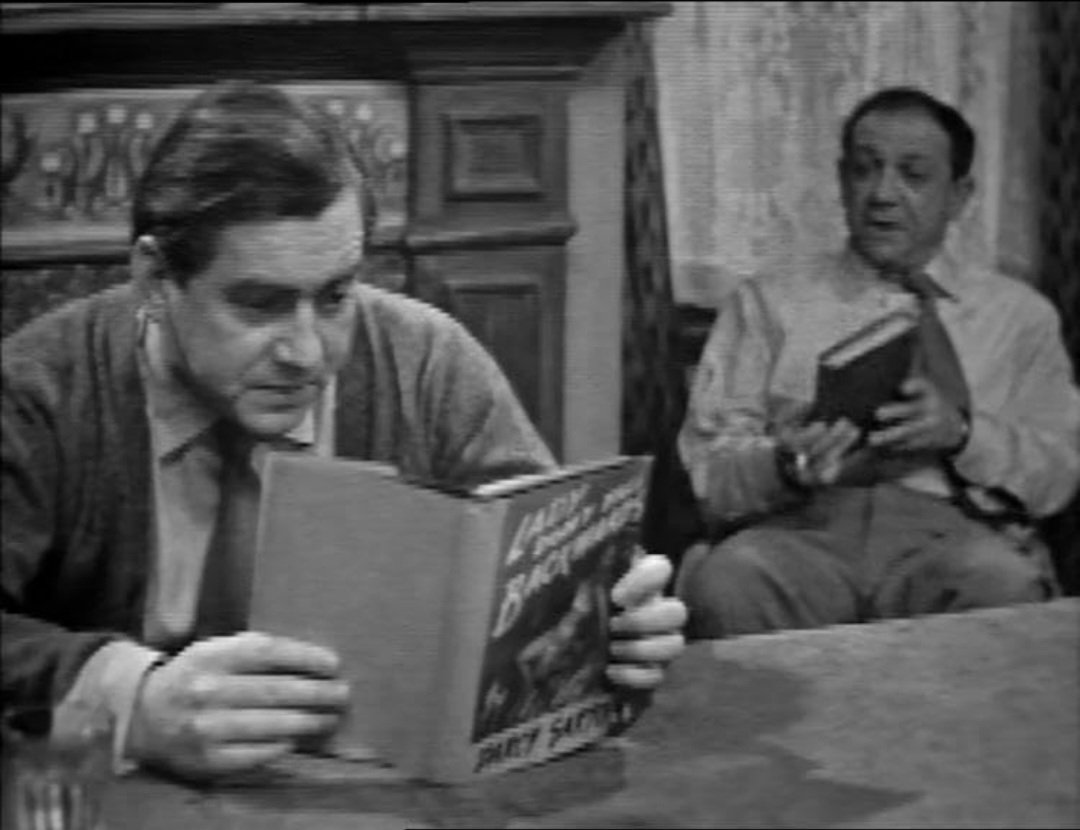 Tony: Do you mind, I'm trying to read, don't interrupt. I'm on the edge of my seat

Sid: Good, is it?

Tony: Good? This is red hot, this is mate. I'd hate to think of this getting into the wrong hands. As soon as I've finished it, I shall recommend they ban it!

#TheMissingPage