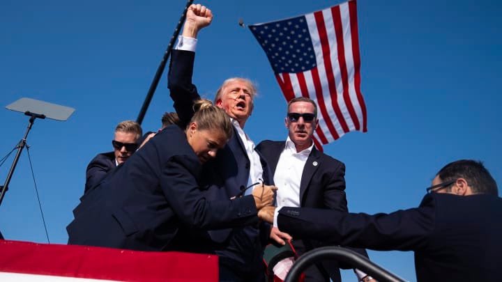 NichOliver401's tweet photo. I believe that this will be @TIME Photo of the Year. Prayers to all those impacted by this shooting. Also prayers for a calmer tone to our divisive American politics. #TrumpAssassinationAttempt @TeamTrump @realDonaldTrump https://t.co/XQx4gyq3cO