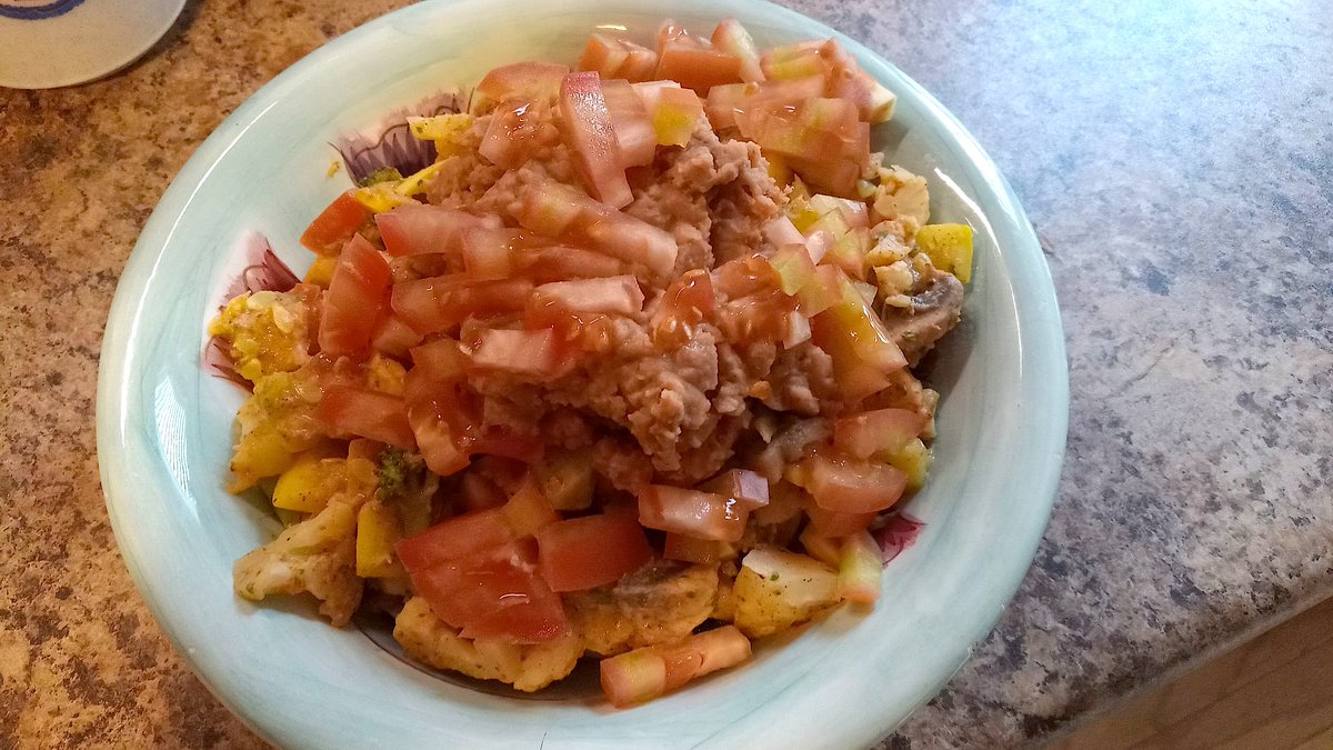 Tonight's Supper: Steamed veggies in a southwestern tofu sauce with re-fried beans and diced tomato. #Plantbased #HealthyFood #Dinner