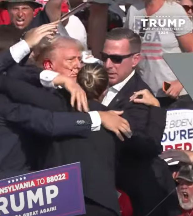 GSP_Exit_63's tweet photo. Shooting at the Trump rally, Trump is up and walking now...  #TrumpRally https://t.co/xhpVqngBhZ
