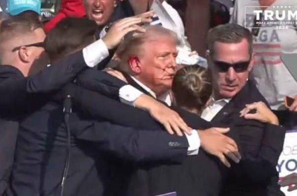 nexta_tv's tweet photo. ‼️ BREAKING: An assassination attempt on Trump  During his speech in Pennsylvania, gunshots rang out. He interrupted his speech and left the venue.   Whether the presidential candidate was injured is unknown at this time. According to media reports, Trump has a bloody ear. The shooter has not yet been caught.
