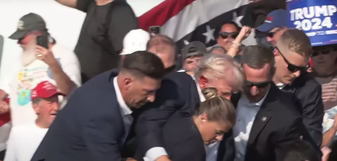 NewsNotBs's tweet photo. 🚨🚨BREAKING NEWS: 
SHOTS have reportedly been fired at a Trump rally in Butler, Pennsylvania. Secret Service agents can be rushing president Trump in the video. This is developing, more to come.

Updates to be posted below:

3:22PM In the video, Trump appears to have a red substance near his ear when being escorted to his vehicle.

3:26PM CONFIRMED, Former President Donald Trump has been shot.

3:32 PM VISUAL confirmation of damage to Trump’s right ear.

3:36 PM: Pictures not suitable for Instagram show close up image of Trump (on x @ NewsNotBS)