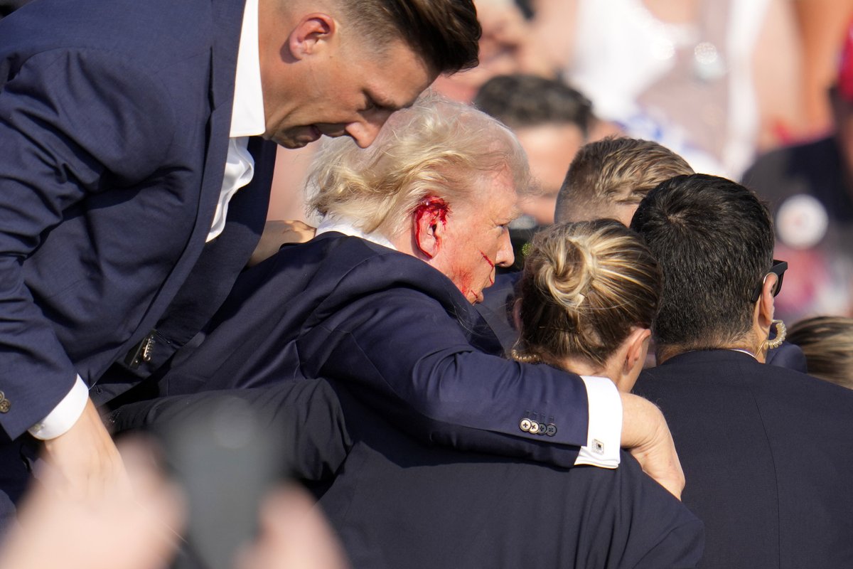 Phil_Lewis_'s tweet photo. Trump was rushed off stage by Secret Service during his rally after loud noises rang through the crowd https://t.co/DWHxWYY6s8 https://t.co/UOaOMx7v3Y