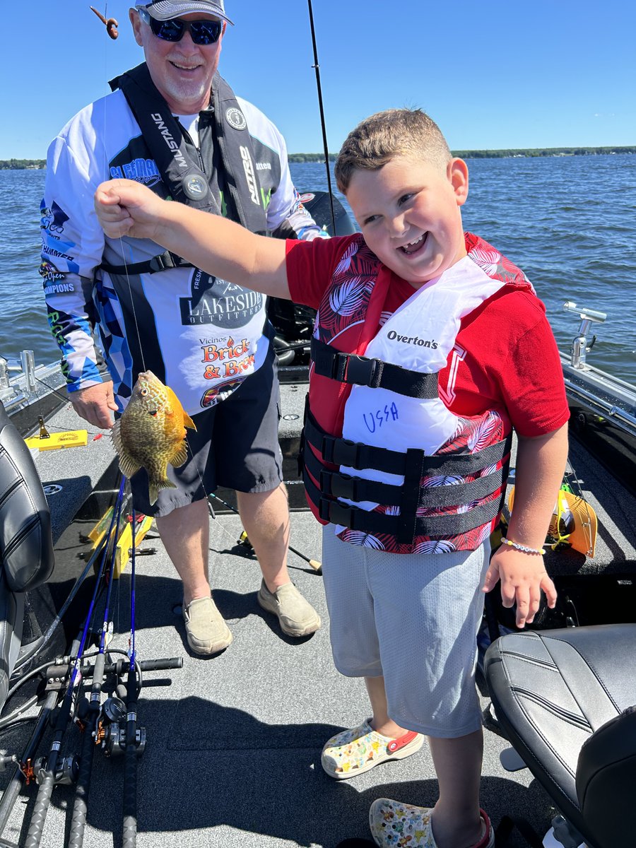 Seven-year-old brother catches a sunfish on his first try for his sister in Heaven!  God bless!  #childswish #ussa #childswish #ussa #fishing #fishinglife #outdoors #DisabilityInclusion #fishingday #thisisfishing #cancer #oneida