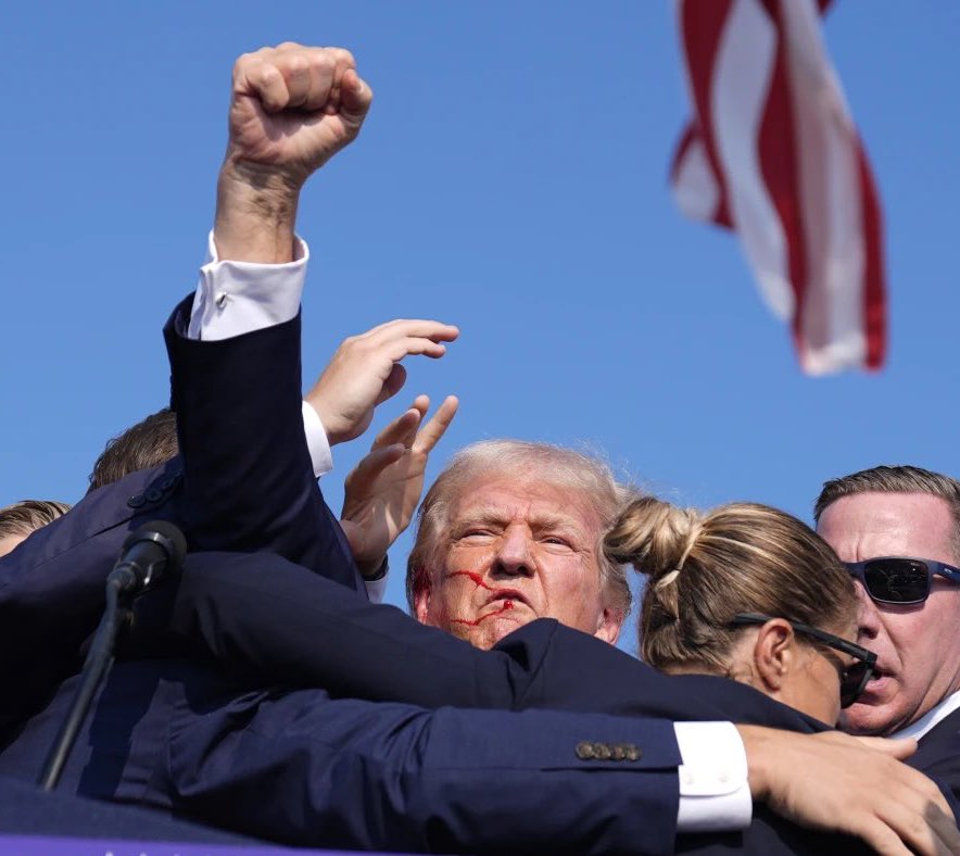 VikashPraj76855's tweet photo. Trump just got shot in the head and got up like a fucking gangster and fist pumped

Hardest picture of all time https://t.co/FrmnAVIaoq