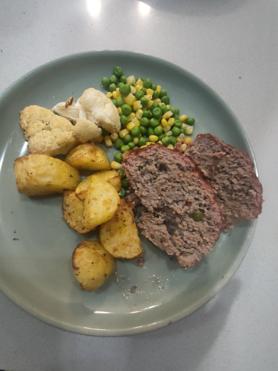Glazed bbq meat loaf done on the Weber kettle with Moroccan potatoes, roasted cauliflower and peas and corn. #bbq #kettle #webergrills