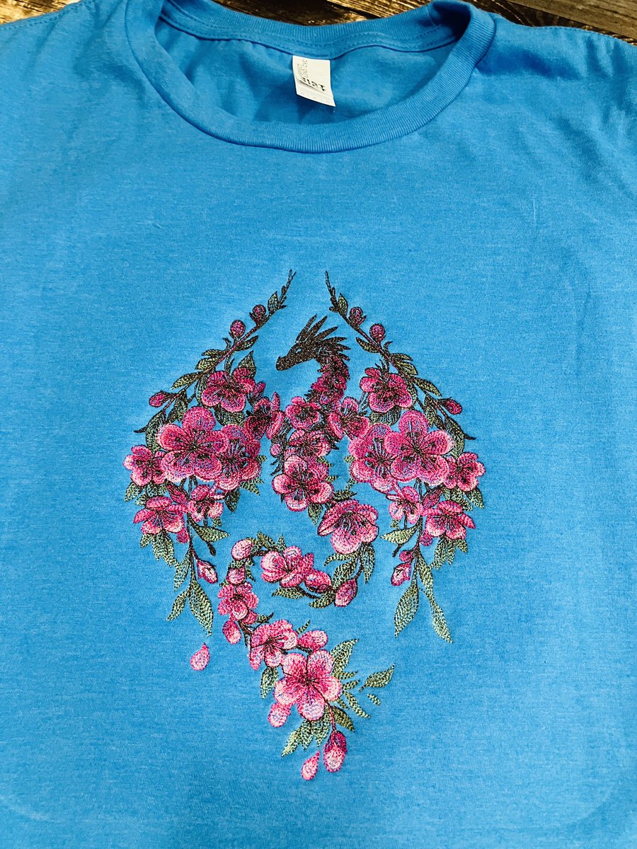 Qualitycuddles's tweet photo. I am so obsessed with this embroidered Sakura dragon tshirt I made! #sakura #smallbiz https://t.co/DoQ7vjts4U