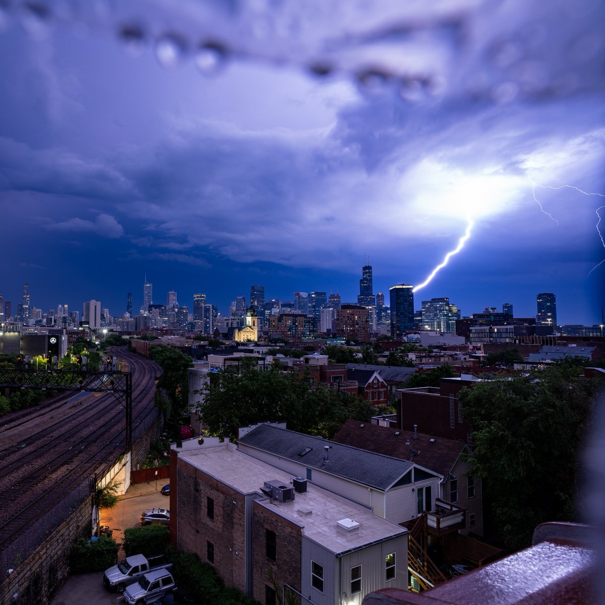 cshimala's tweet photo. Late last night the sky lit up with a few bolts on the Chicago skyline. There was plenty of rain as well. The photo on the right still has the plastic bag protecting my camera in view. #ilwx https://t.co/CWXZdWVmX4