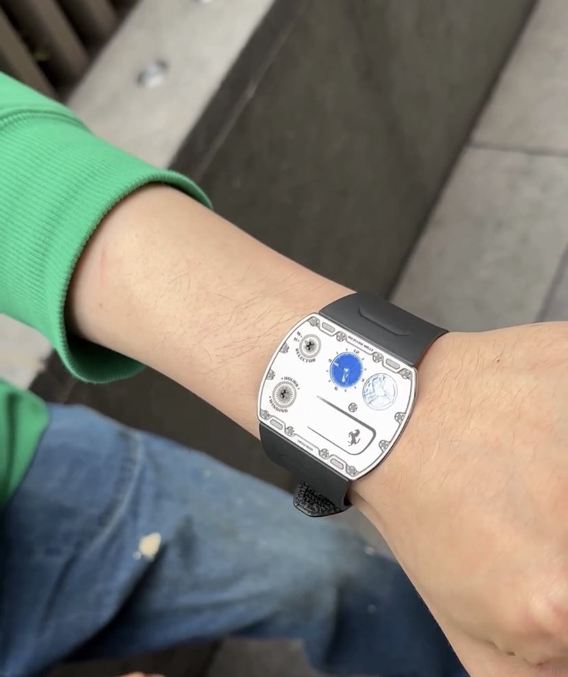 Phemzy's tweet photo. He was spotted with the Richard Mille RM UP-01 Ferrari. This is the tiniest wristwatch I’ve ever seen. Check it out in the comment section 

 #watchtok #richardmille #rmup01 #luxurywatches #ferrari https://t.co/6RbeJSHSBV