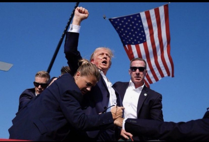 IvSolly's tweet image. This photo alone will have anyone from the R, L or in the middle run through a wall for this man. The shooter hits his ear and Trump still stands with his secret service swarming him, yelling “FIGHT, FIGHT, FIGHT!!” A leader for the people! 

As our nation’s flag waves in the…