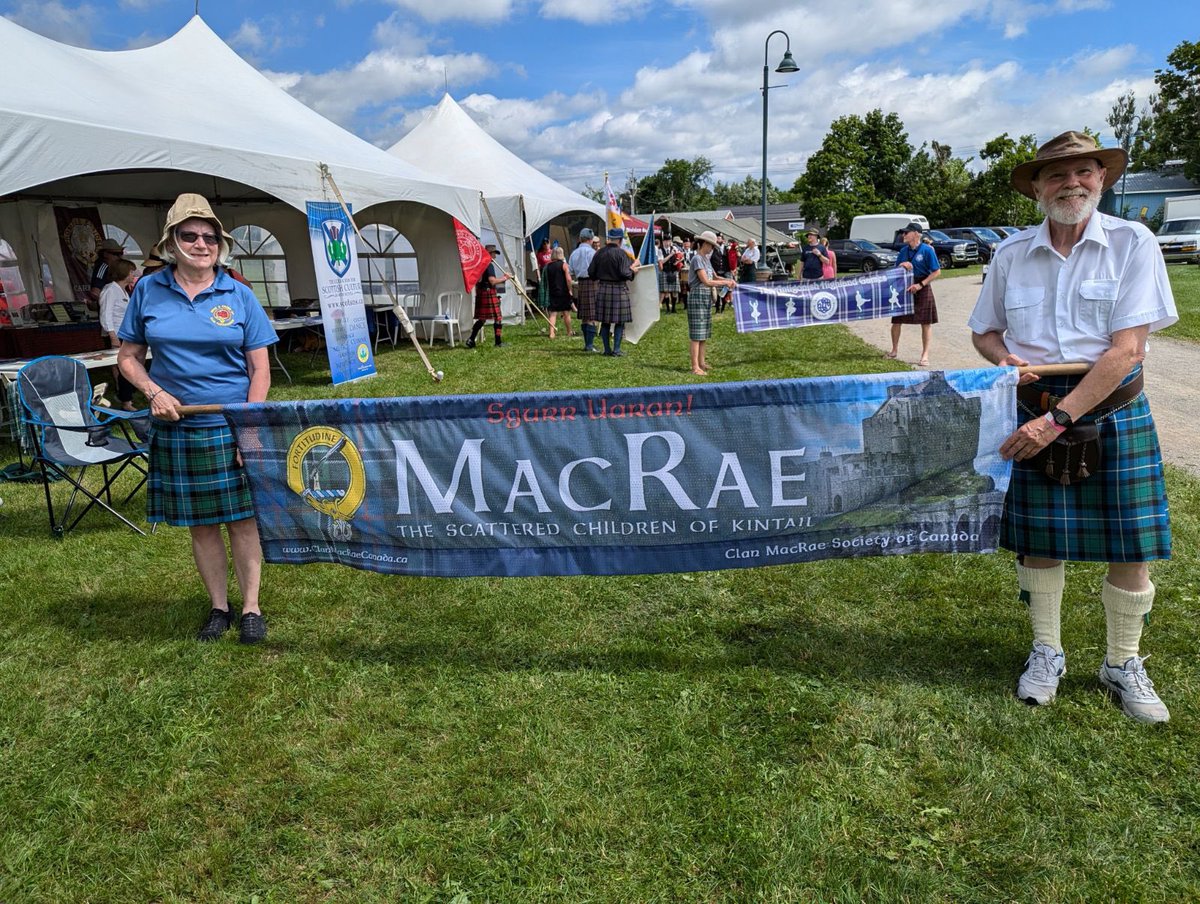 Director Mary Pellerin, President Bill and wife Lynn at the July 13 &amp; 14 Antigonish Highland Games, Nova Scotia. Getting ready for the Clan Parade at the games with the 10' Clan Banner