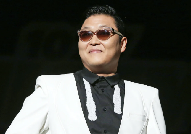 PSY apologized on social media following criticism over his weight loss, addressing concerns raised by fans. He shared a video of himself enjoying a meal, emphasizing his intent to take control of his eating habits after facing scrutiny from both online critics and attendees at