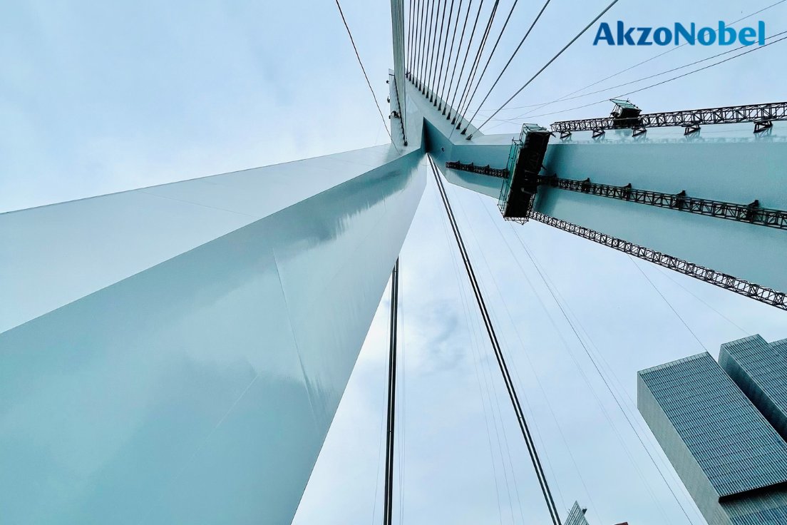 AkzoNobel's tweet photo. The original blue color of the #ErasmusBridge in Rotterdam is being restored, thanks to our #Sikkens brand. Around 1500 liters of light blue paint will be used to protect the iconic Dutch bridge as part of a complex renovation project.
#AkzoNobel #PaintTheFuture #VanDerEnde https://t.co/01oiBjPbpx
