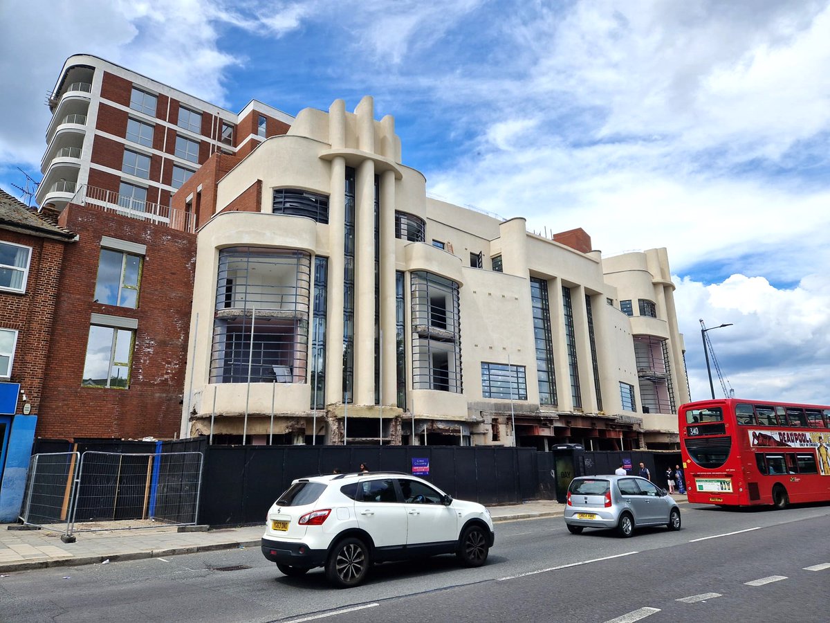 C20Society's tweet image. Great to see the restored façade of the former Dominion Cinema in Harrow being revealed in these new pictures.
Built in 1936 to designs by Frank Ernest Bromige, the Art Deco cinema was entombed in metal cladding from 1962 for nearly 60 years, until it was finally removed in 2021.…