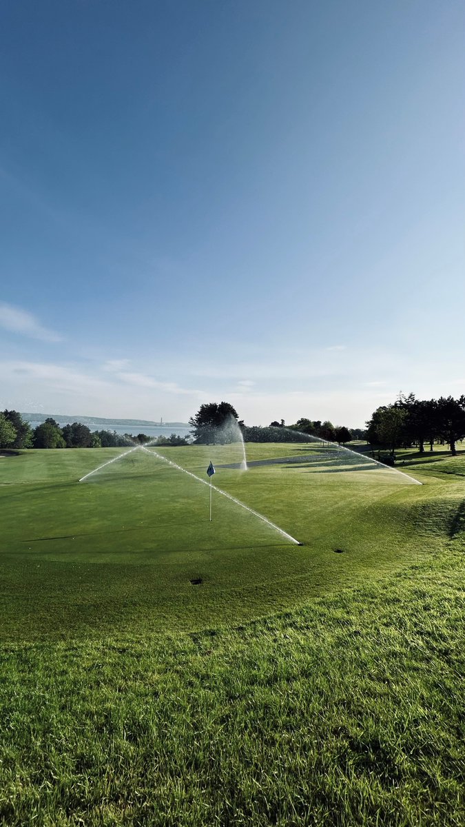 Watering the 15th green, 5th fairway and Belfast Lough behind. #belfastlough #golf #oldestgolfclubinireland #greenkeeping