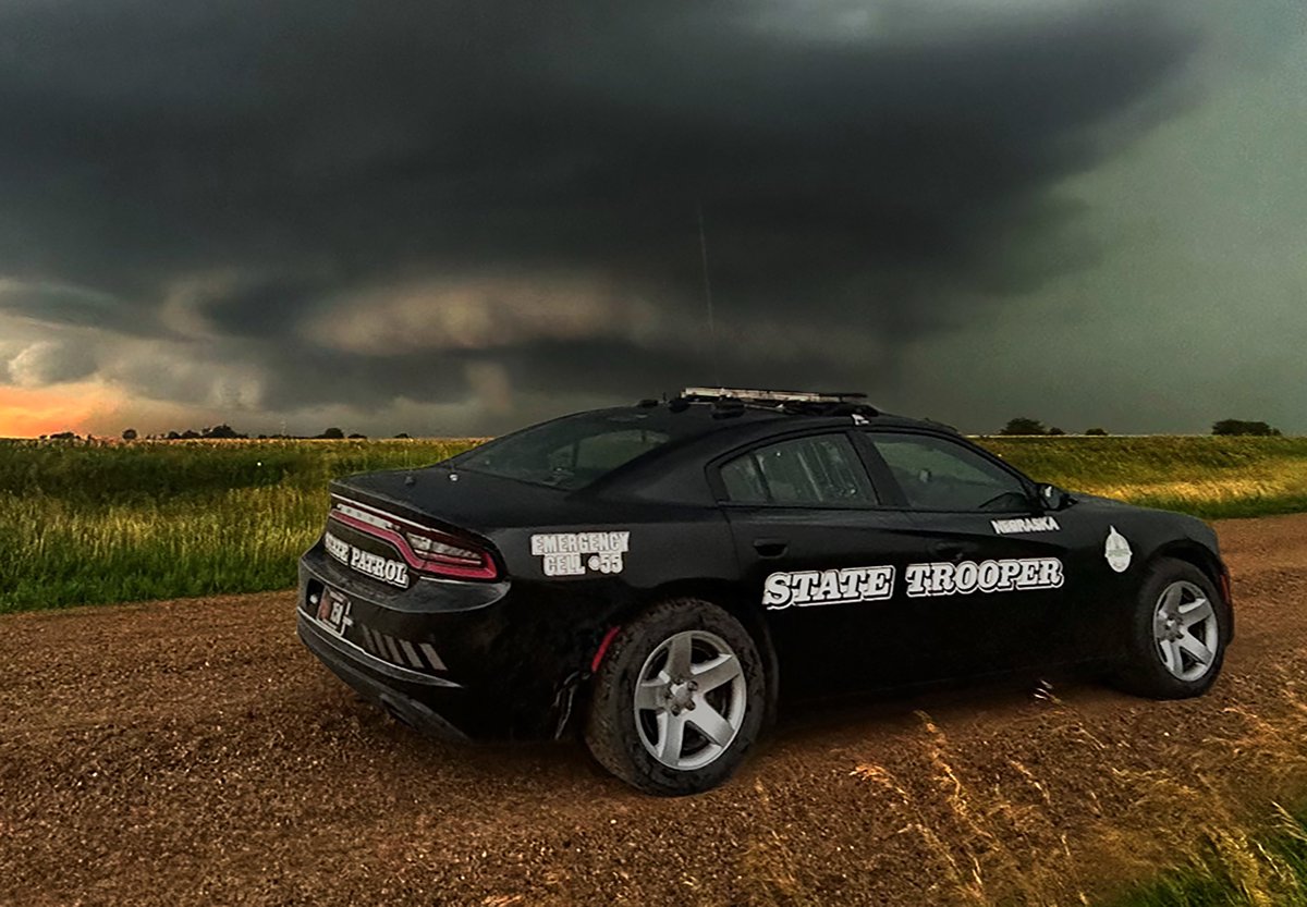 NEStatePatrol's tweet photo. Time to vote for Nebraska in the @State_Troopers_ #CruiserCalendar contest! 

Vote here: https://t.co/awBFexzkZk

Representing the Tornadic 2024 we've had, vote Nebraska! https://t.co/4b441UrvCw