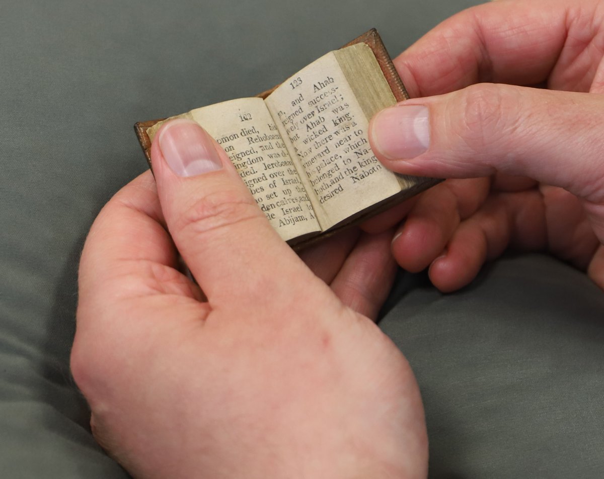 Clarke_Library's tweet image. While searching through the stacks, student assistants recently came upon an interesting book - a miniature Bible! This discovery brings a whole new meaning to the phrase "pocket Bible." #TinyBook