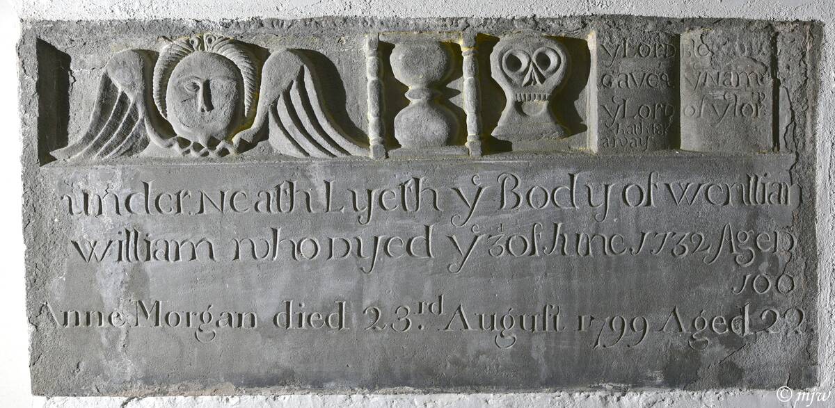#MementoMoriMonday Wall memorial in St Tydfil, Llysworney, #Wales to
Wenllian William "who dye ye 30th June 1732 aged 100" (a respectable age for this times). The bible (top right) reads "Ye Lord gave &amp; ye Lord hath taken away; blessed be the name of the Lord" (Job 1:21)