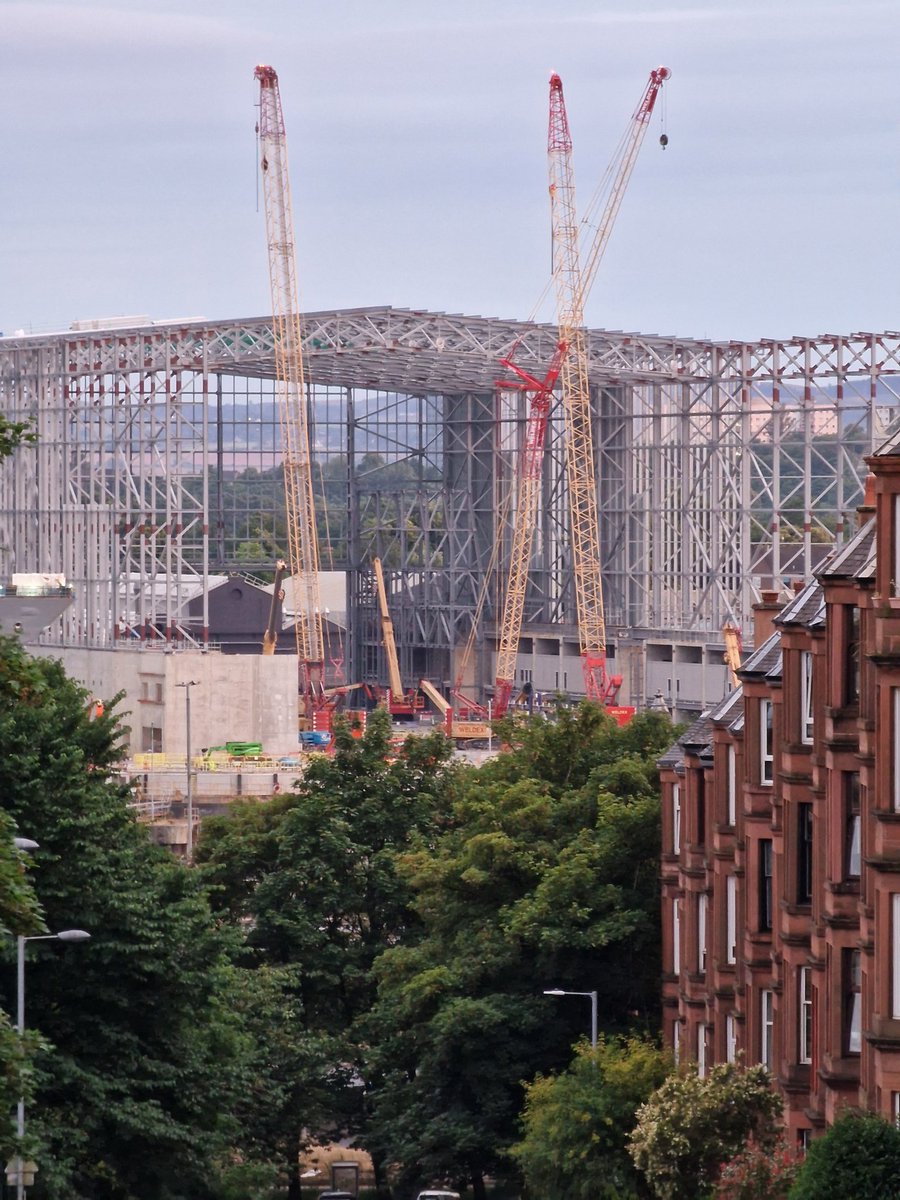 The colossal scale of the new Ship Build Hall at Govan Shipyard is now becoming clearer as the roof truss installation continues.

It dwarfs Thornwood's tenements and the bow of HMS Belfast on the left. 

When completed next year, it will become one of Europe's biggest buildings.