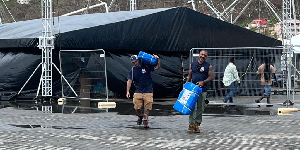 heart911team's tweet photo. #HEART911 #HurricaneBeryl Response Team is in #Carriacou, #Grenada to assist in all aspects of hurricane response. Thank you HEART 9/11 volunteers from #Local79, #LiUNA and #FDNY for supporting our mission. https://t.co/oFuK3lBz2p https://t.co/kBZm1ki8wK