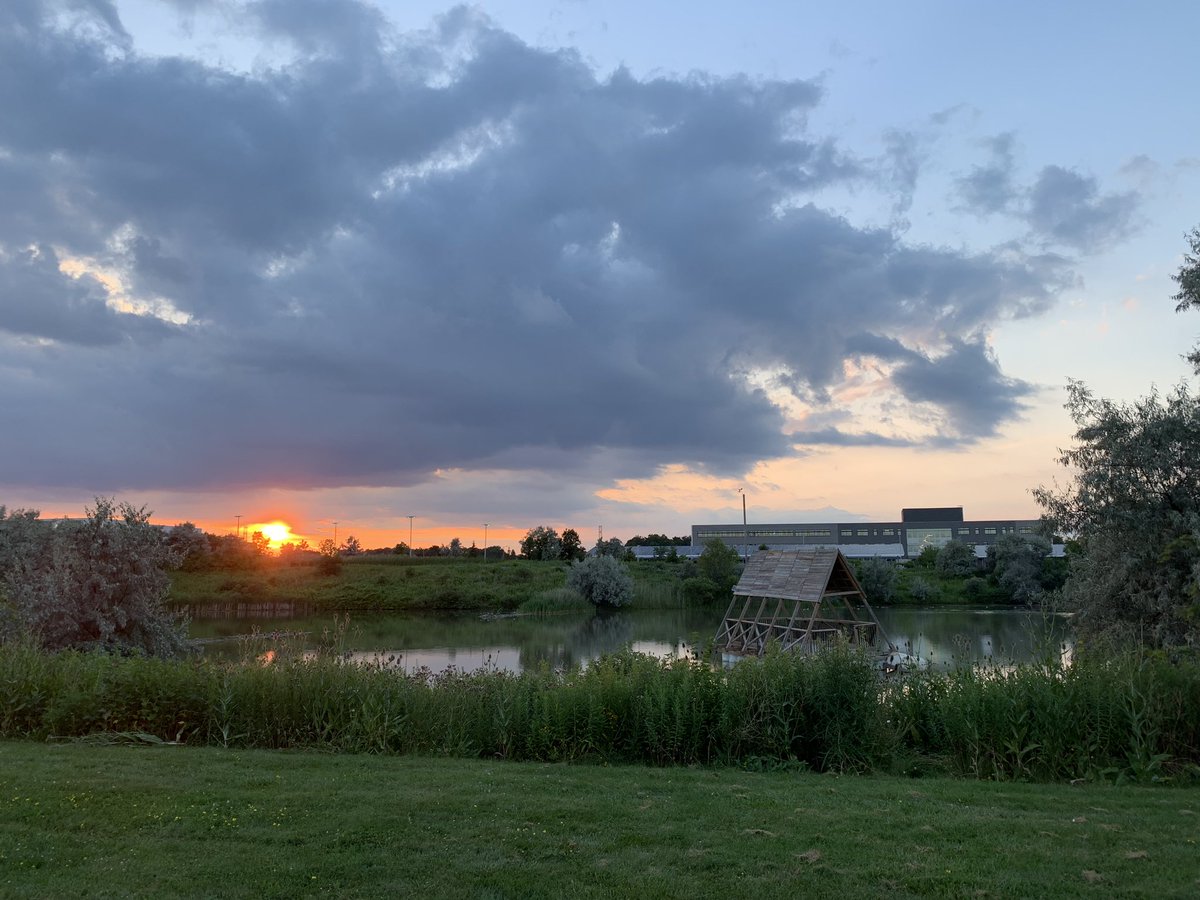 UWLowVision's tweet photo. Lovely evening sky on this warm evening on campus by the amphibious architecture research pavilion behind @UwOptometry #uwaterloo https://t.co/G8paGuGpu4