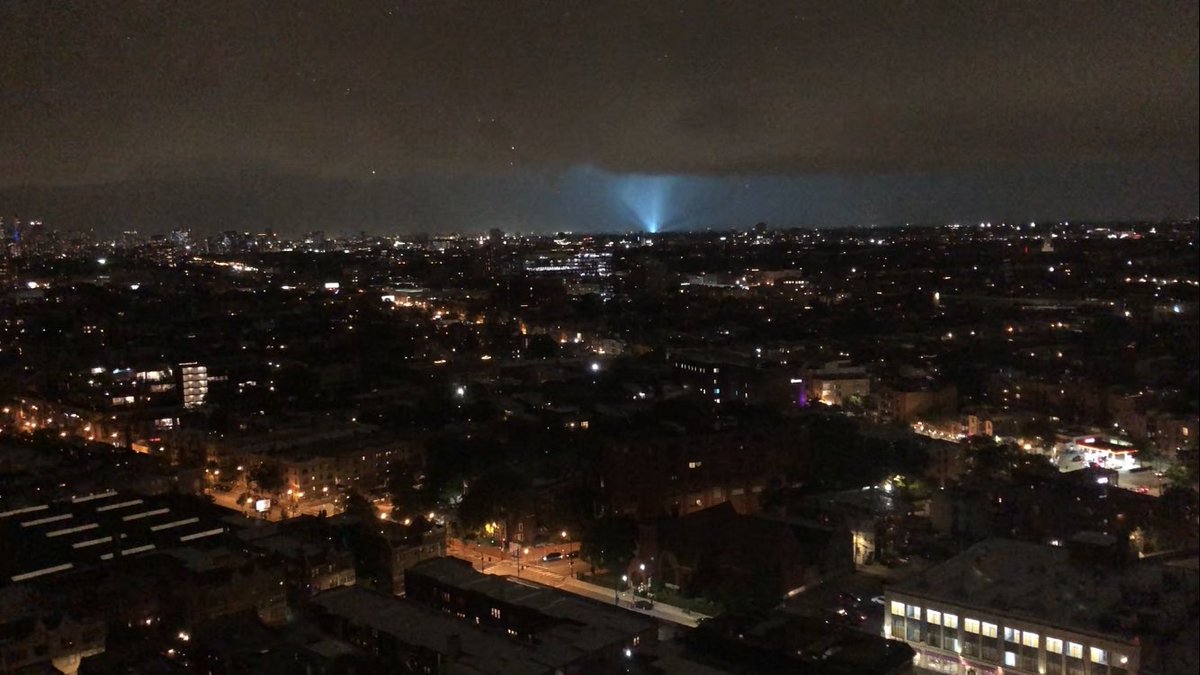 MFanta219's tweet photo. What do y’all think? Did I catch the incoming downtown tornado there on the left. The transformer light bends around a bit. Second photo is another transformer still. #tornado https://t.co/bCXItHc8vy