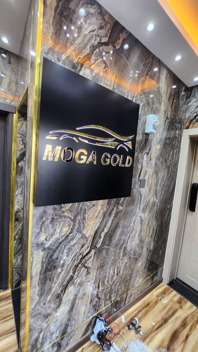 AkASign3dSign's tweet image. A stunning signage installation by our company, Al Khat Al Arred, for &quot;MOGA GOLD.&quot; The sign features an elegant design with the company’s logo and name, crafted with precision and style. Set against a luxurious marble wall with gold accents.